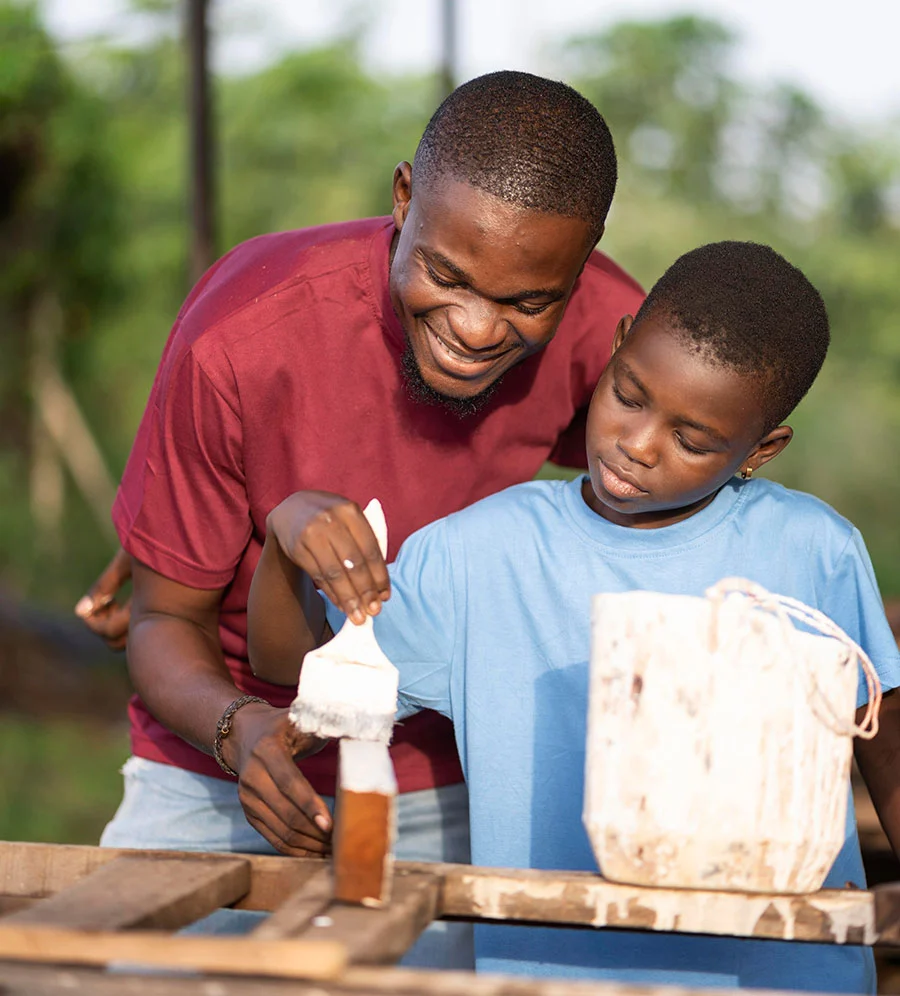 Kid taught how to paint